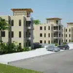Modern beige apartment complex with balconies, palm trees, and parked cars along a street under a clear blue sky
