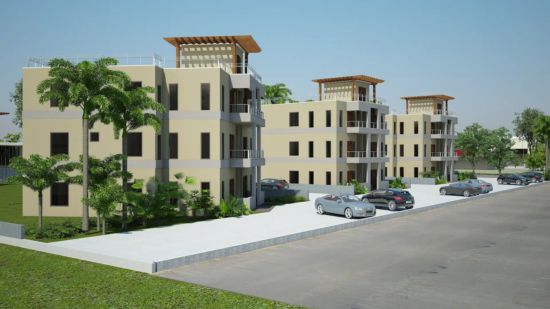 Modern beige apartment complex with balconies, palm trees, and parked cars along a street under a clear blue sky